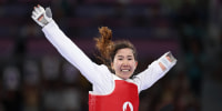 Zakia Khudadadi of the Refugee Paralympic Team celebrates after winning the women's taekwondo K44 -47kg repechage contest against Nurcihan Ekinci of Turkey.