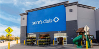 The outside of a Sam's Club storefront with blue and white signs