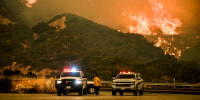 California Department of Forestry and Fire Protection supervisors look on as the Line Fire continues.