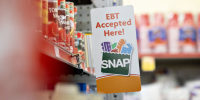 An "EBT Accepted Here" sign at a Family Dollar store.