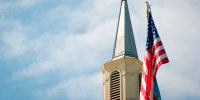 Church steeple and American flag