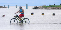 Geral Hammond pedals through flood water