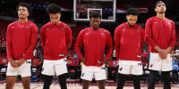 Miami Heat players stand for the National Anthem