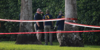 FBI agents investigate the area around Trump International Golf Club