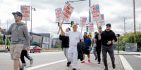 Striking Boeing workers picket outside the Boeing Co. manufacturing facility