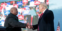 Mark Robinson shakes hands with Donald Trump