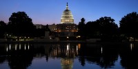 The U.S. Capitol Building is reflected in the Capitol Reflecting pool