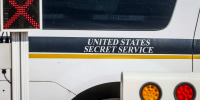 United States Secret Service sign is seen on a car.