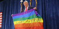 Donald Trump holds a rainbow flag