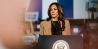 Kamala Harris stands at a podium