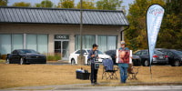 Anti-abortion protesters stand outside abortion clinic.