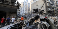 An Israeli air strike killed at least 22 people in central Beirut on October 10, as Israeli ground troops in Lebanon were accused of firing on the UN's peacekeeping headquarters, injuring two Blue Helmets.