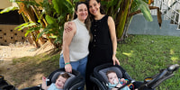 Ashley Louise and Claire Wasserman pose for a photo with their twins Antonia and Raphael.