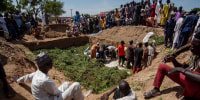People prepare bodies for burial, following a tanker explosion in Majiya town, Nigeria, Wednesday, Oct. 16, 2024.