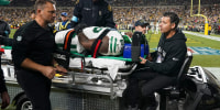 New York Jets guard Xavier Newman is carted off the field after being injured in the second half of an NFL football game against the Pittsburgh Steelers in Pittsburgh on Sunday. 2024. 