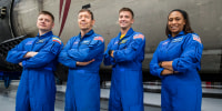 The four crew members that comprise the SpaceX Crew-8 mission pose for a photo inside SpaceX Hangar X at the Kennedy Space Center