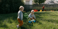 Kinser and Perry Hurley play in the backyard with their brother in Springfield, Ill., on Sept. 26, 2024.