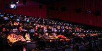 Moviegoers watch a film at an Alamo Drafthouse 