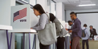 Asian woman voting booths in polling station office