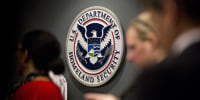 The U.S. Immigration and Customs Enforcement (ICE) seal hangs on a wall before a speech by U.S. Vice President Mike Pence, not pictured, at the agency headquarters in Washington, D.C., U.S., on Friday, July 6, 2018. 