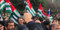 Protesters rally outside the parliament building in the capital of Georgia's breakaway region of Abkhazia 