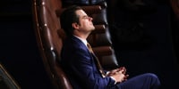 Matt Gaetz sitting in the House Chamber