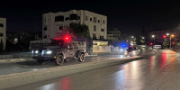 Police vehicles near the Israeli embassy in Amman, Jordan.