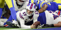 Josh Allen #17 of the Buffalo Bills scores a touchdown against the Los Angeles Rams.