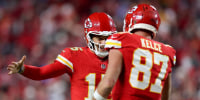 Patrick Mahomes #15 of the Kansas City Chiefs celebrates with Travis Kelce #87.