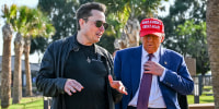 Elon Musk greets President-elect Donald Trump as he arrives to attend the launch of the SpaceX Starship rocket on Nov. 19, 2024 in Brownsville, Texas. 