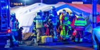 Emergency personnel next to the Christmas market after a car reportedly plowed into the crowd in Magdeburg, Germany. 