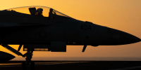 A fighter jet maneuvers on the deck of the USS Dwight D. Eisenhower in the Red Sea, June 11, 2024. 