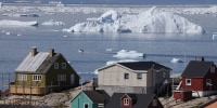 Icebergs drift by in Disko Bay on July 15, 2024 at Ilulissat, Greenland. 