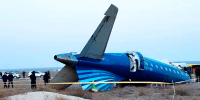 Azerbaijan Airlines' Embraer 190 lies on the ground near the airport of Aktau, Kazakhstan, on Thursday, Dec. 26, 2024.