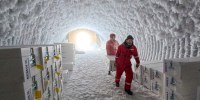 People walk through an ice core storage cave