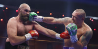 Oleksandr Usyk punches Tyson Fury