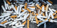 Cigarette butts piled outside