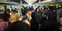 The packed platform illustrates the intensity of the holiday migration as millions travel across the country on January 14, 2025, in Chongqing, China.