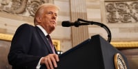 President Donald Trump speaks at a podium