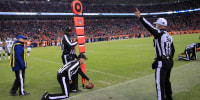 A NFL referee signals a first down call in 2014.