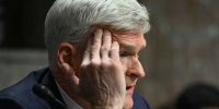 Sen. Bill Cassidy, R- La., Robert F. Kennedy Jr. testifies during a Senate Finance Committee hearing on Jan. 29, 2025.