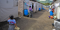 Guatemalan mother and children living in refugee camp.