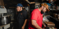 Down North Pizza staff Kaseem Ali, left, with executive chef Michael Carter, in the kitchen