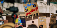 Protesters with signs.