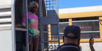 A Haitian being deported steps out of a truck in Carrizal, Dominican Republic