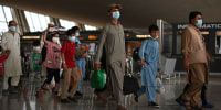 Afghan Refugees Arrive At Dulles Airport After US Pulls Out Final Troops