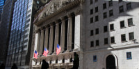 Pedestrians walk past the New York Stock Exchange in New on Jan. 28, 2025. 