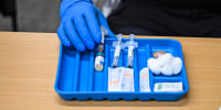 A health worker prepares a dose of the measles vaccine at a health center in Lubbock, Texas, on Feb. 27, 2025.