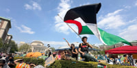 A demonstrator waves a flag