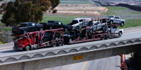 Trucks enter the United States from Mexico at the U.S. border